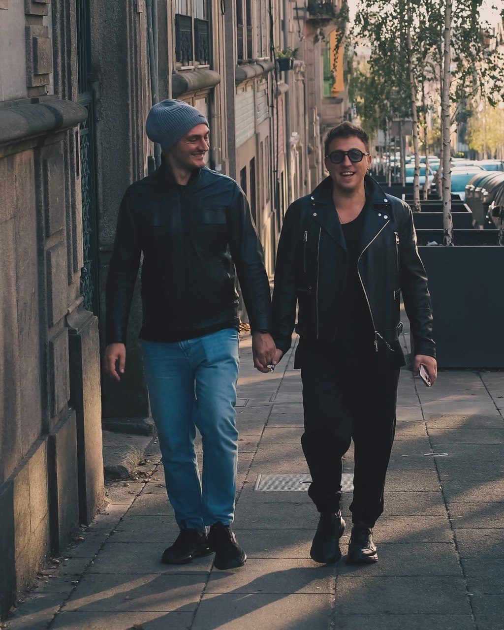 Roman Domashnii and Seva Belchenko walking hand in hand in Porto